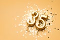 35 years birthday celebration festive background made with golden candle in the form of number Thirty five Royalty Free Stock Photo