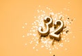 32 years birthday celebration festive background made with golden candle in the form of number Thirty two Royalty Free Stock Photo