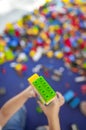 4 years boy building a tower with with interlocking plastic bricks game