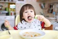 2 years boy eating soup with meat balls Royalty Free Stock Photo