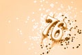 76 years celebration festive background made with golden candles in the form of number Seventy-six