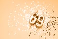 69 years celebration festive background made with golden candles in the form of number Sixty-nine