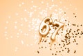 67 years celebration festive background made with golden candles in the form of number Sixty-seven