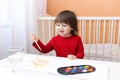 2 years child painting with water color paints Royalty Free Stock Photo