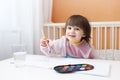 2 years child painting with water color paints at home Royalty Free Stock Photo