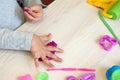 3 years girl creative arts. Child hands playing with colorful clay. Plasticine. play dough. Self-isolation Covid-19, online Royalty Free Stock Photo