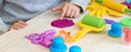 3 years girl creative arts. Child hands playing with colorful clay plasticine. Self-isolation Covid-19, online education, Royalty Free Stock Photo
