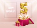 5 years with a Golden balloon. The celebration of the anniversary. Balloons with sparkling confetti fly out of the box, number 5 Royalty Free Stock Photo