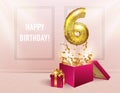 6 years with a Golden balloon. The celebration of the anniversary. Balloons with sparkling confetti fly out of the box, number 6 Royalty Free Stock Photo