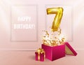 7 years with a Golden balloon. The celebration of the anniversary. Balloons with sparkling confetti fly out of the box, number 7 Royalty Free Stock Photo