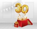 30 years of Golden balloons. The celebration of the anniversary. Balloons with sparkling confetti fly out of the box, number 30. Royalty Free Stock Photo