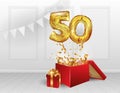 50 years of Golden balloons. The celebration of the anniversary. Balloons with sparkling confetti fly out of the box, number 50. Royalty Free Stock Photo