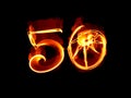 50 years isolated numbers lettering written with fire flame or smoke on black background