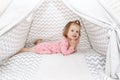 2 years little girl in wigwam tent at home Royalty Free Stock Photo