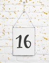 16 years old birthday party card with number sixteen with golden Royalty Free Stock Photo
