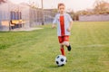 8 years old boy child playing football Royalty Free Stock Photo