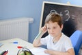 7 years old boy doing his homework Royalty Free Stock Photo