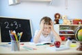 7 years old boy doing his homework Royalty Free Stock Photo