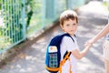 7 years old boy going to school with his mother Royalty Free Stock Photo