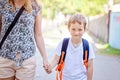 7 years old boy going to school with his mother Royalty Free Stock Photo