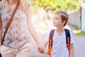 7 years old boy going to school with his mother Royalty Free Stock Photo