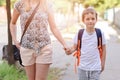 7 years old boy going to school with his mother Royalty Free Stock Photo