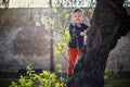 A small boy having fun climbing up on the tree in the park Royalty Free Stock Photo