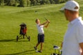 11 years old boy practice golf hits at golf course Royalty Free Stock Photo