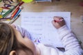 6 years old child girl doing writing homework in her room Royalty Free Stock Photo