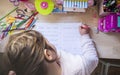 6 years old child girl doing writing homework in her room Royalty Free Stock Photo