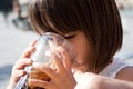 4 years old girl drinking cola Royalty Free Stock Photo