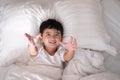 3 years old little cute Asian boy at home on the bed, kid lying Royalty Free Stock Photo