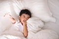 3 years old little cute Asian boy at home on the bed, kid lying Royalty Free Stock Photo