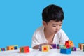 3 years old little cute Asian boy play toy or square block puzzl Royalty Free Stock Photo