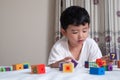 3 years old little cute Asian boy play toy or square block puzzl Royalty Free Stock Photo