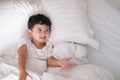 3 years old little cute Asian boy at home on the bed, kid lying Royalty Free Stock Photo