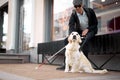 25 years old man suffer from blindness, get help by dog guide Royalty Free Stock Photo