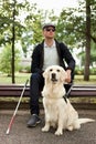 25 years old man suffer from blindness, get help by dog guide Royalty Free Stock Photo