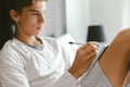 16 years old teenage boy writing school notes or doing homework Royalty Free Stock Photo