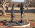 `95 Years and Planting, Girl Scout Centennial Statue` by Shan Gary in Mitch Park in Edmond, Oklahoma.