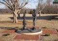 `95 Years and Planting, Girl Scout Centennial Statue` by Shan Gary in Mitch Park in Edmond, Oklahoma.