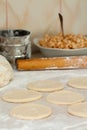 Yeast dough with flour. Making apple pies.