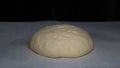 Yeast dough increases in size on black background