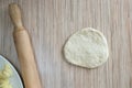 A cake of raw dough lies on the surface of the table for further preparation Royalty Free Stock Photo