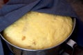 Yeast dough raw in a bowl on a wooden table. Homemade raw yeast dough Royalty Free Stock Photo