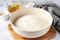 yeast dough rising in a covered bowl Royalty Free Stock Photo