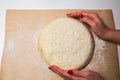 Yeast dough on the table. Baking concept. Cooking ideas. Woman`s hands making homemade food. Knead flour and water Royalty Free Stock Photo