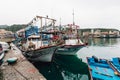 Yehliu fishing harbor with fisherman boats floating on the river in fisherman village in northern Taipei