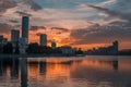 Yekaterinburg city center on sunset. City pond view, amazing clouds and sky. High buildings, skyscrapers on the embankment