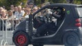 Yekaterinburg, Russia-August, 2019: Racer drifts on mini car. Action. Man spinning in car at motorcycle festival